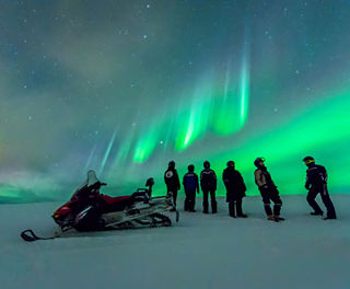 norway snowmobiles and aurora arctic coast htgrtn