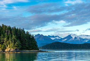 alaska shoreline near juneau with distant mountains istk