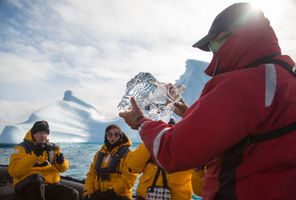 arctic zodiac cruise inspecting clarity of ice qe