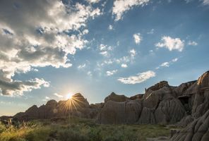 canada alberta sun setting on hoodoos dinosaur provincial park ta