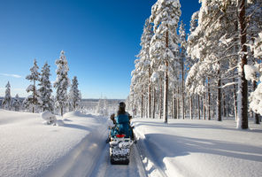 finland lapland snowmobile taiga sunshine istk