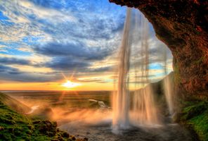 iceland seljalandsfoss summer sunset cloudy sky istk