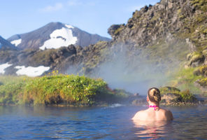 iceland woman relaxing in hot springs landmannalaugar astk