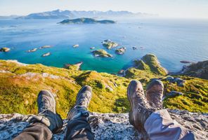 northern norway hikers resting at viewpoint senja istk