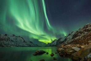 northern norway northern lights over fjord tromso doll