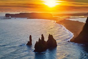 south coast iceland reynisdrangar rock stacks evening sun rth