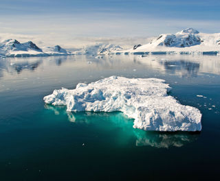 antarctica blue icebergs in tranquil channel sstock