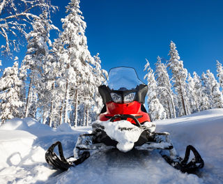 finland lapland snowmobile front on taiga istk