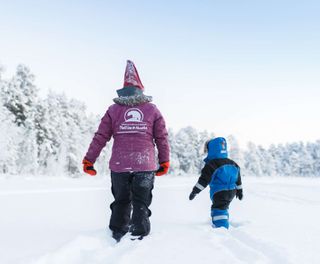 finnish lapland nellim adult child in snow