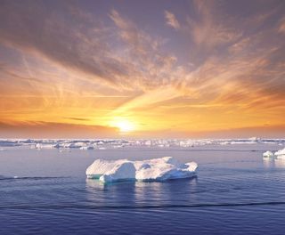 greenland disko bay sunset over ice floes near ilulissat istk