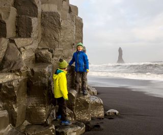 iceland south west children on basalt cliff reynisdrangar istk