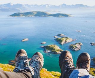 norway hikers resting at viewpoint istk