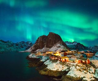 norway lofoten islands reine aurora over mountains istk