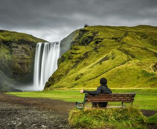 south iceland taking in the view at skogafoss istk