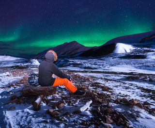 svalbard aurora with person istk