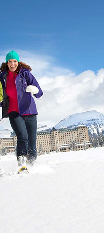 alberta fairmont chateau lake louise hotel snowshoe couple