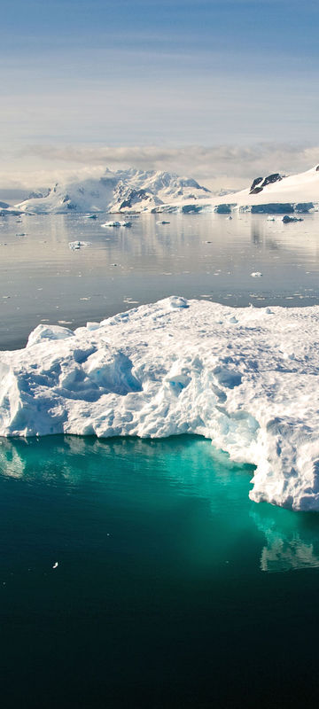 antarctica blue icebergs in tranquil channel sstock