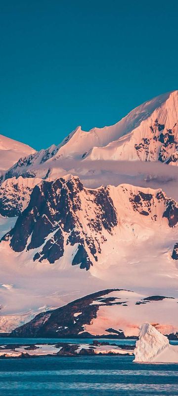 antarctica pink reflection on mountains istk