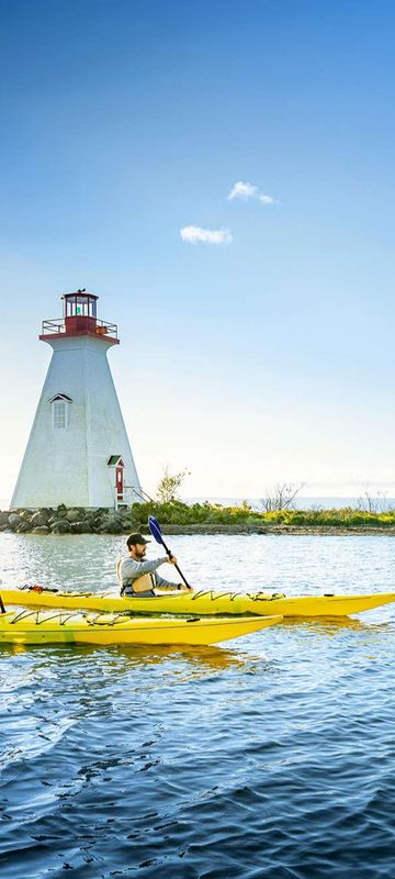 canada nova scotia kayaking past kidston lighthouse baddeck nstb