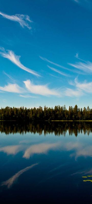 east finland clouds reflected in lake jarvimaisema hk