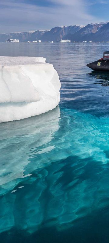 east greenland scoresbysund zodiac water view of iceberg rth