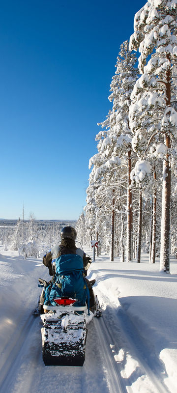 finland lapland snowmobile taiga sunshine istk