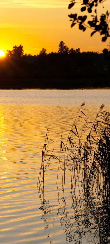 finland sunset over lake istk