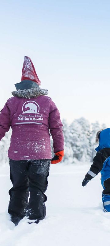 finnish lapland nellim adult child in snow