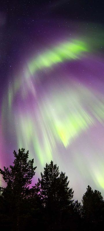 finnish lapland red and green northern lights nellim