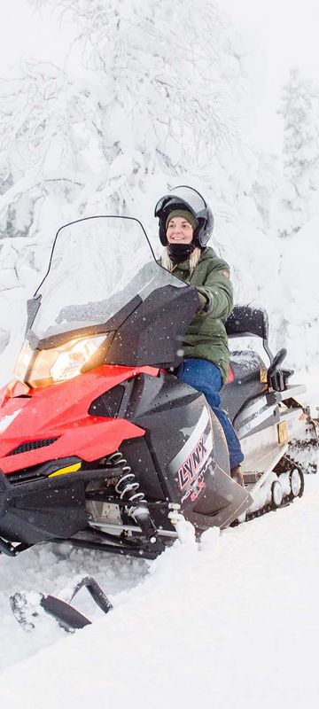 finnish lapland snowmobiling through snowy forest vf