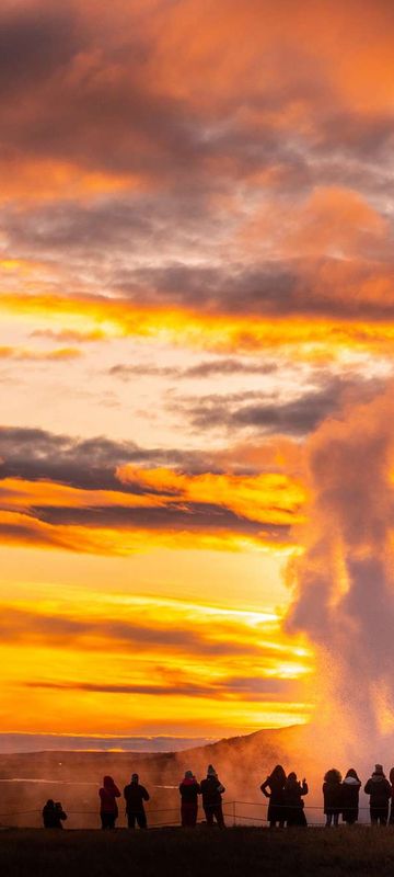 iceland south west strokkur geysir sunset people istk