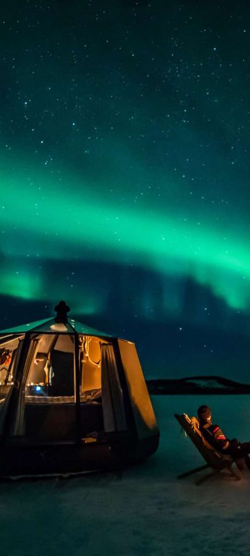 Nangu Wilderness Hotel aurora hut with northern lights above