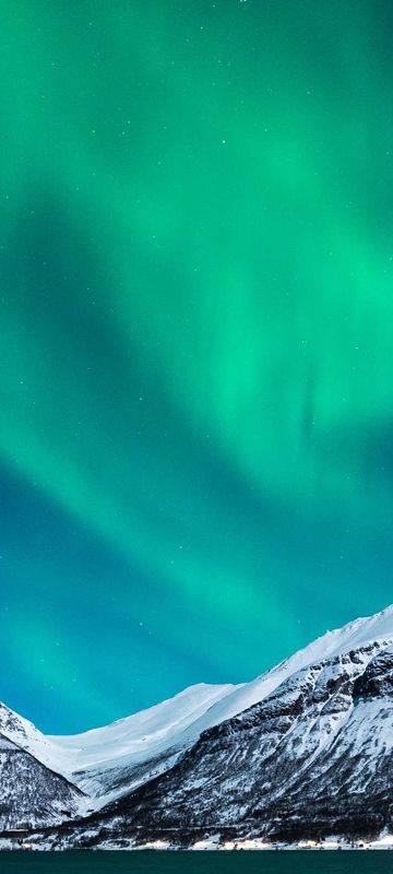 northern norway aurora over snow covered mountains gt