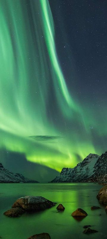 northern norway northern lights over fjord tromso doll