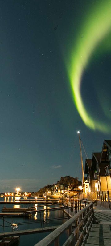 northern senja hamn i senja aurora over apartments