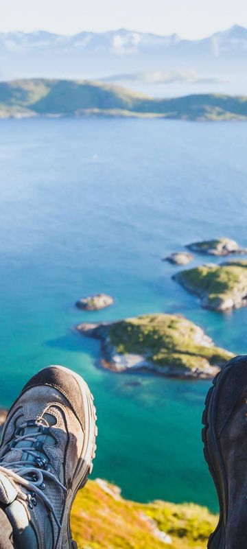 norway hikers resting at viewpoint istk