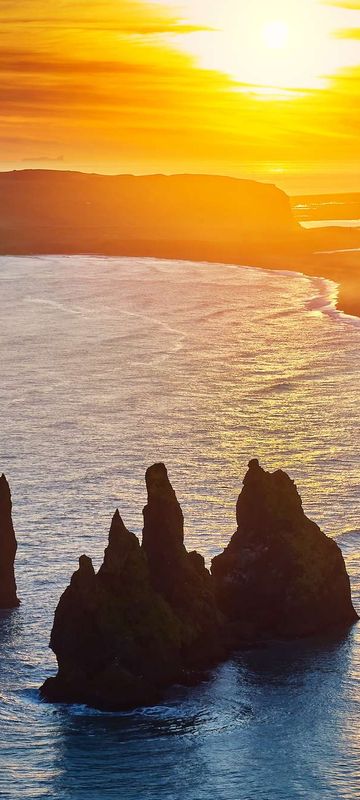 south coast iceland reynisdrangar rock stacks evening sun rth