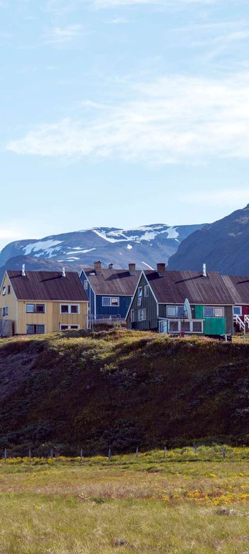 south greenland coloured houses on hill in narsaq istk