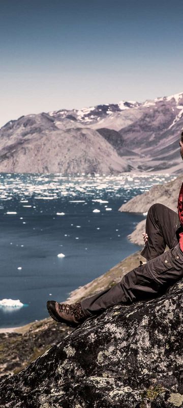 south greenland hiker overlooking qooroq ice fjord near narsarsuaq vg