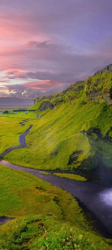 south west iceland seljalandsfoss pink sky robert lukeman unsplash