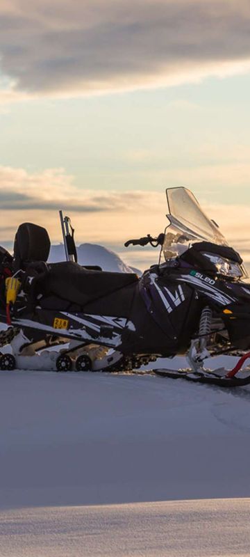 svalbard electric snowmobile daytime hurtigruten la