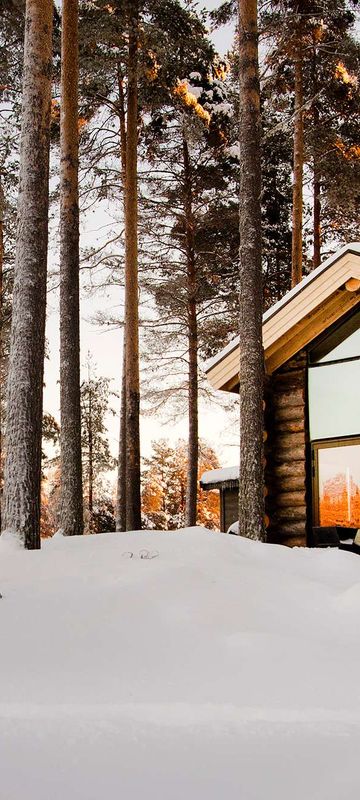 swedish lapland arctic retreat cabin at sunset