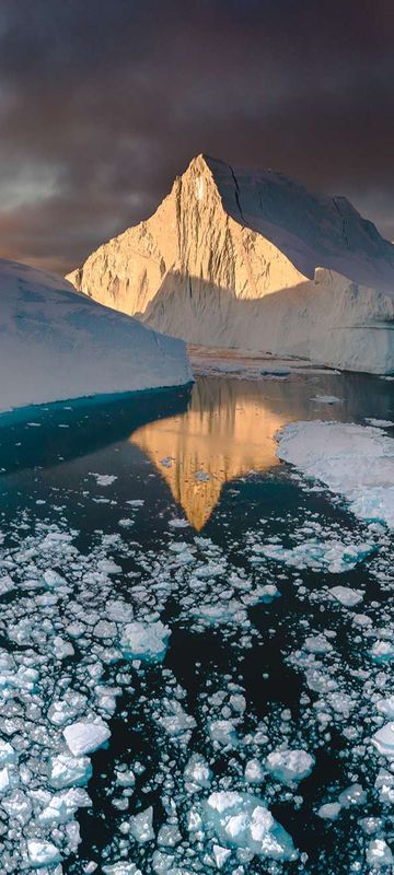 west greenland ilulissat light reflected on icebergs vg