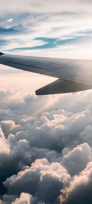 aircraft-wing-through-clouds-by-jerry-zhang-unsplash