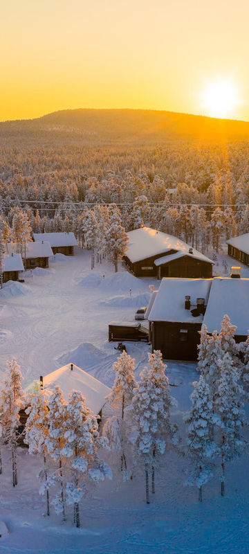 finnish-lapland-aerial-view-over-inari-wilderness-hotel-winter-sun