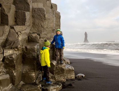 iceland south west children on basalt cliff reynisdrangar istk