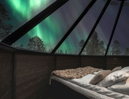 Gaze at the northern lights from an Aurora Cabin at Nellim Wilderness Hotel