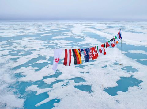 arctic multi nation flags at north pole qe