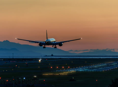 canada plane landing at sunset istk