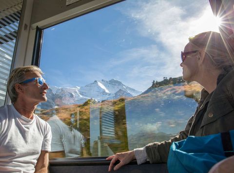 couple enjoying alpine views from train istk